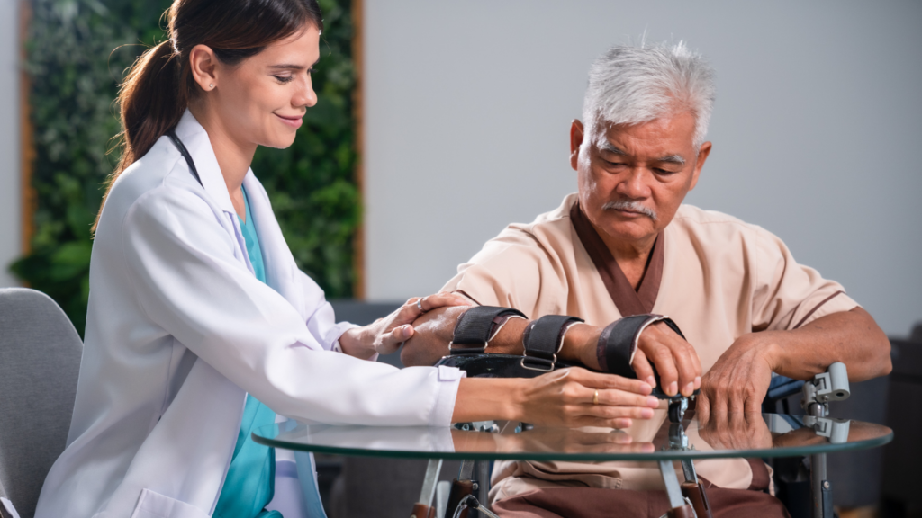 A doctor is helping an elderly person in a wheelchair