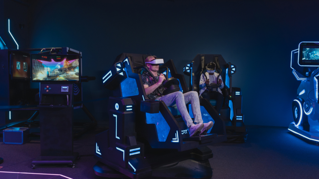 a group of people playing vr games in a dark room