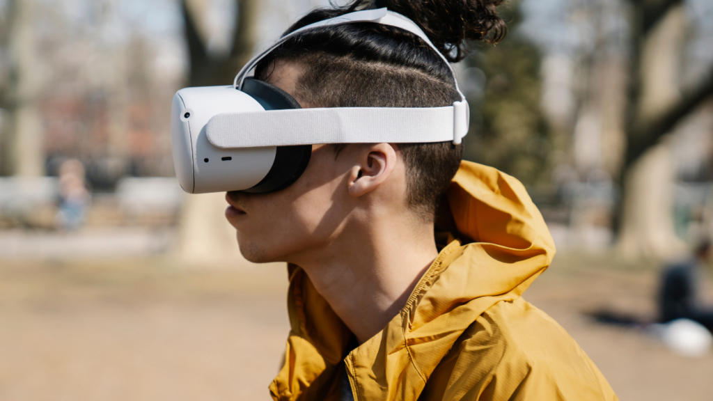 a person wearing a virtual reality headset in the park