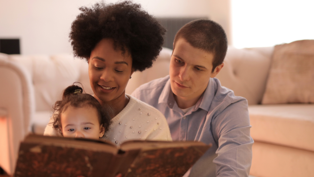 A family reading a book together