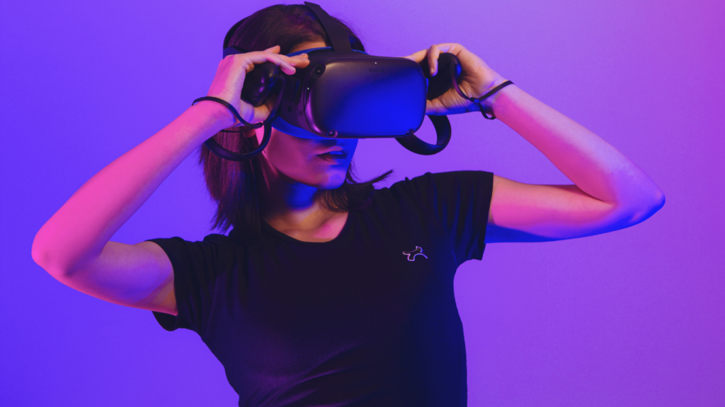 a person wearing a virtual reality headset in front of a purple and blue background