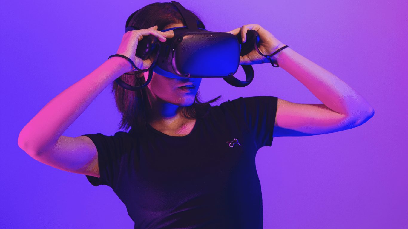 a person wearing a virtual reality headset in front of a purple and blue background