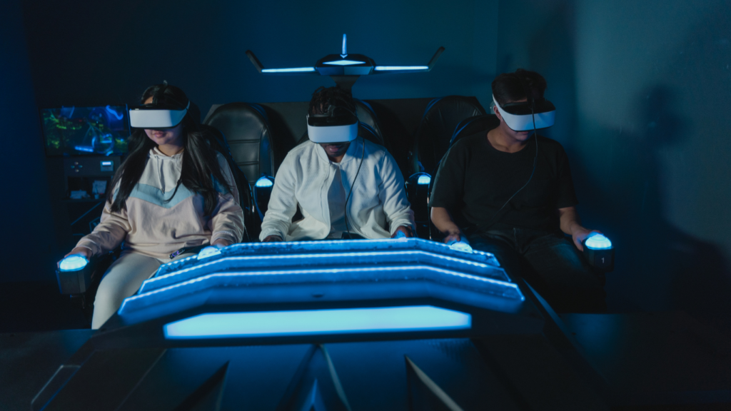 a group of people playing vr games in a dark room