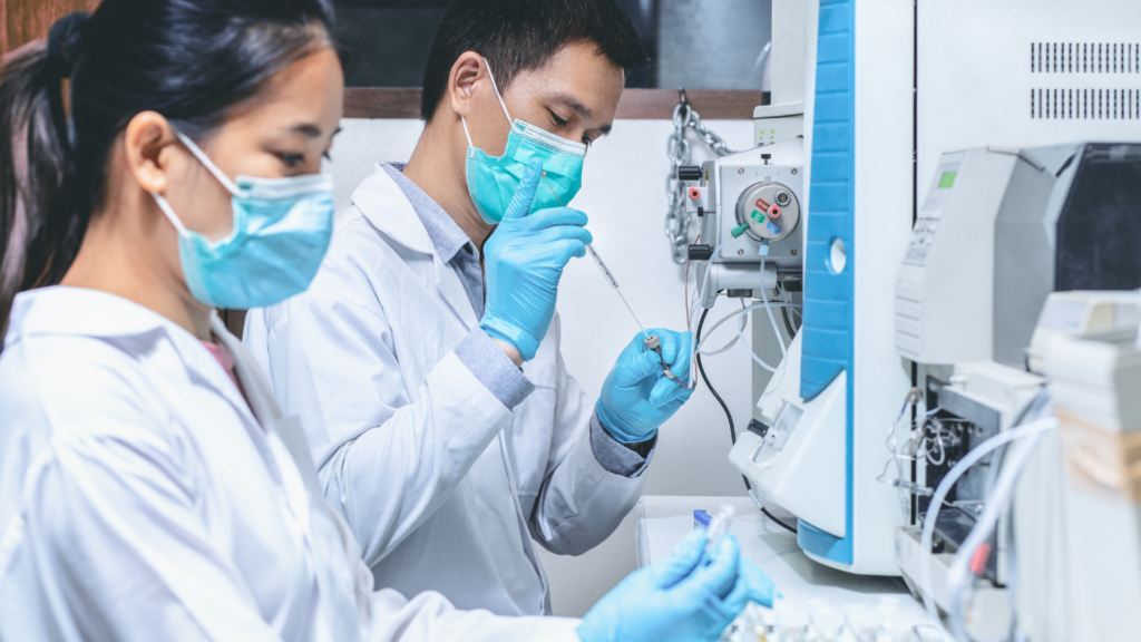 a person in a lab coat is holding a test tube