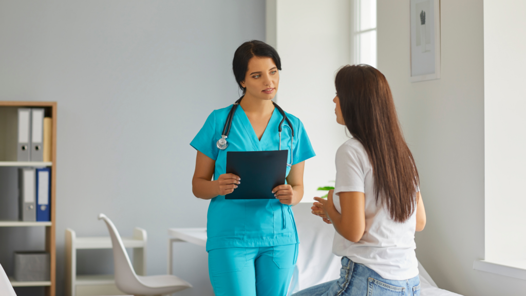 a person wearing a surgical mask and holding a tablet