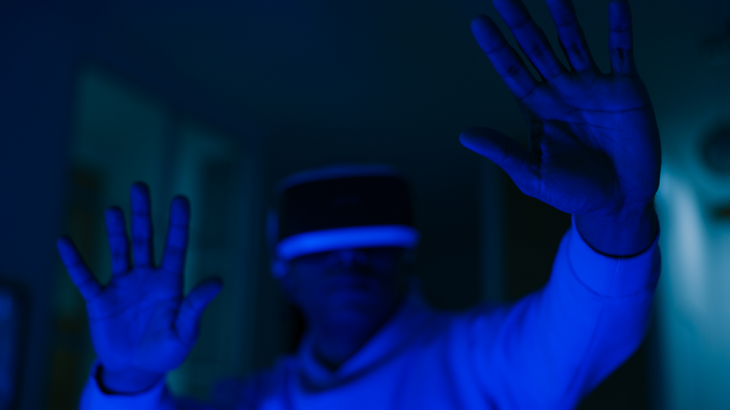 a person wearing a virtual reality headset in front of a purple and blue background