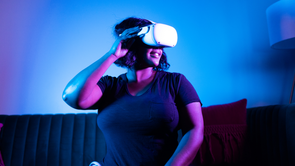 a person wearing a virtual reality headset in neon background